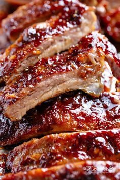 barbecue ribs covered in bbq sauce on a plate