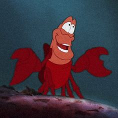 an animated cartoon character with red wings