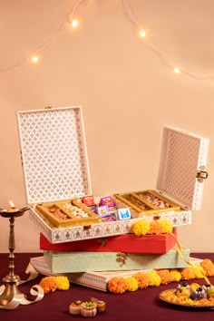 a table topped with lots of different types of cakes and desserts on top of each other