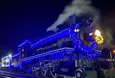 a train is lit up with blue lights