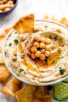 hummus with pita chips on the side