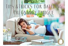 a pregnant woman laying on top of a couch in front of a window with the words tips and tricks for battling precannoy fatigue