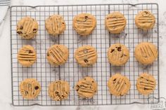 chocolate chip cookies on a cooling rack ready to go into the oven for bake