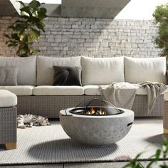 a living room with couches and a fire pit