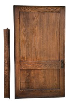 a wooden door with two pieces of wood on the front and side panels, both in different sizes