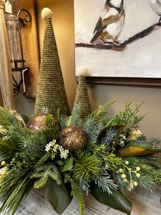 two christmas trees sitting on top of a table