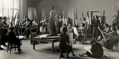 an old black and white photo of people in a room