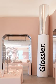 a large white object sitting in the middle of a room with pink walls and flooring