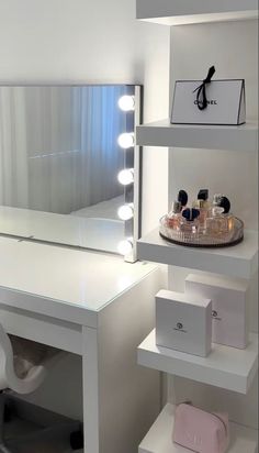 a white desk topped with a mirror and lights