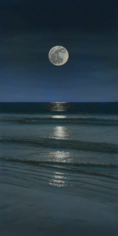 the full moon shines brightly over the ocean