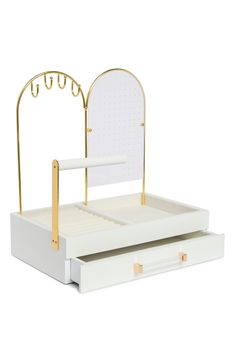 a white and gold bed with a mirror on top