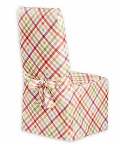 an upholstered chair with a plaid pattern on the back and seat, tied in a bow