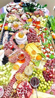 a table filled with lots of different types of food on it's trays