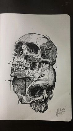 a drawing of a human skull on a notebook