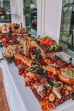 a long table covered in lots of different types of food