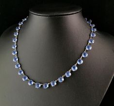 "A gorgeous vintage mid century era blue paste riviere necklace.  The perfect piece to add a dash of sparkle or pop if colour to your favourite little black dress.  It features rich blue round cut paste stones set into silver plated steel.  It has a spring ring fastener and the length can be adjusted slightly with the additional chain length.  Condition: Good used condition overall, signs of use and wear commensurate with age, a little wear to the plating.  Approx measurements: 18\" length max  7.1mm paste width  Any questions or queries please contact us. FREE WORLDWIDE SHIPPING." Blue Round Necklaces For Evening, Riviere Necklace, Stone Settings, Spring Rings, Chain Lengths, Etsy Vintage, Round Cut, Necklace Etsy, Silver Plated