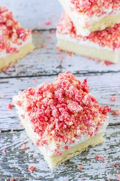 white cake with red sprinkles on top