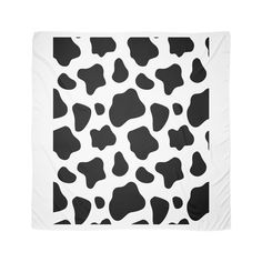 a black and white cow print blanket