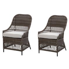 two brown wicker chairs with white cushions