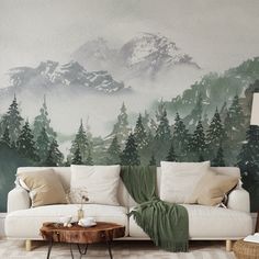 a living room filled with furniture and a painting on the wall above it's couch