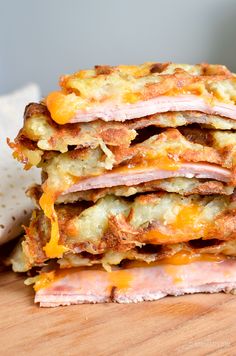 a stack of food sitting on top of a wooden table