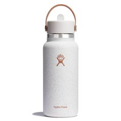 the hydro flask water bottle is white and has a brown handle on it's side