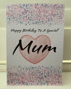 a birthday card with the word mum written on it and a heart in the middle