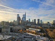 an aerial view of a city skyline with tall buildings and skyscrapers in the background