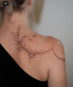 a woman with a tattoo on her back