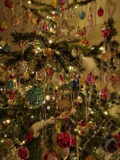 a christmas tree with ornaments hanging from it