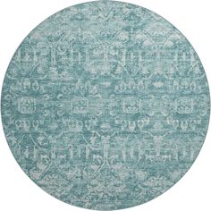 a round rug with an ornate design in blue and white on the inside of it