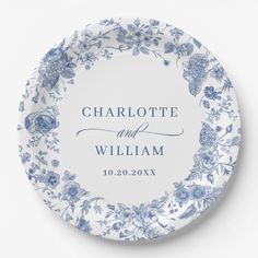 a blue and white plate with the words charlotte and william on it, surrounded by flowers