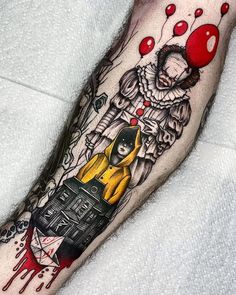 a person with a clown tattoo on their leg