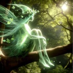 a green fairy sitting on top of a tree branch