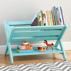 the book caddy is blue and has books on it