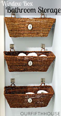 three baskets are hanging on the wall