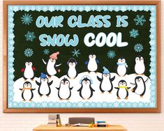 a group of penguins standing in front of a blackboard that says our class is snow cool