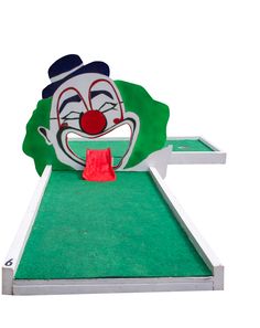 a close up of a miniature golf course with a clown face on it