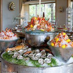 an assortment of seafood on display in a restaurant