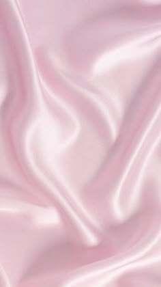 a close up view of a pink satin fabric