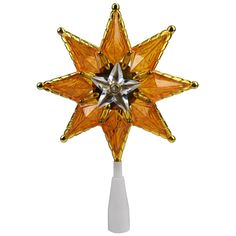 an ornament shaped like a star on top of a white pole