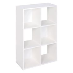 a white bookcase with four compartments on each side