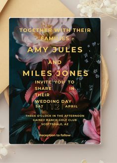 a wedding card with flowers on it