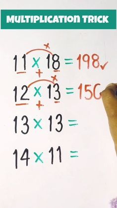 a hand writing on a white board with multiplyed numbers and times below it