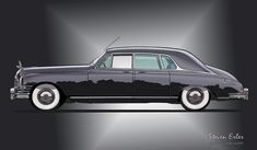 an old black car with white rims parked in front of a gray wall and floor