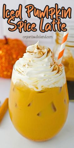 iced pumpkin spice latte in a glass with whipped cream