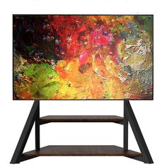 an abstract painting is displayed on a tv stand with shelving unit underneath it and below