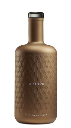 a brown bottle with the word distiller on it's side and a silver lid