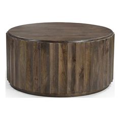 the round wooden table is made from wood and has metal trimmings on it