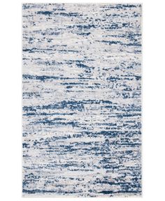 a blue and white rug with an abstract design on the bottom, it is very soft